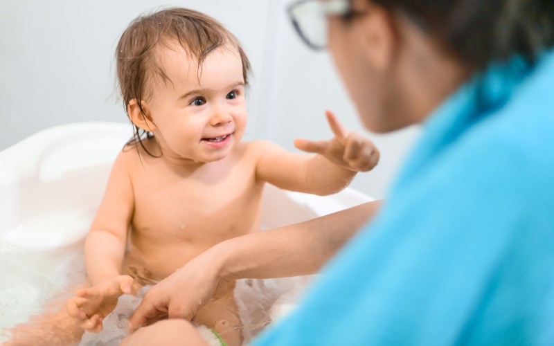 https://www.ashtonbee.com/wp-content/uploads/2021/10/happy-1-year-old-baby-bathtub.jpg
